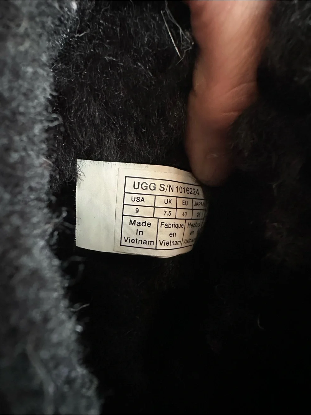 Tall black UGG boots